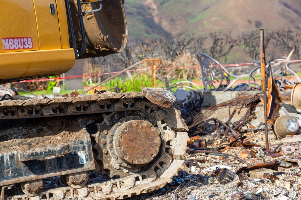 Debris Removal Continues at Fire-Damaged Home