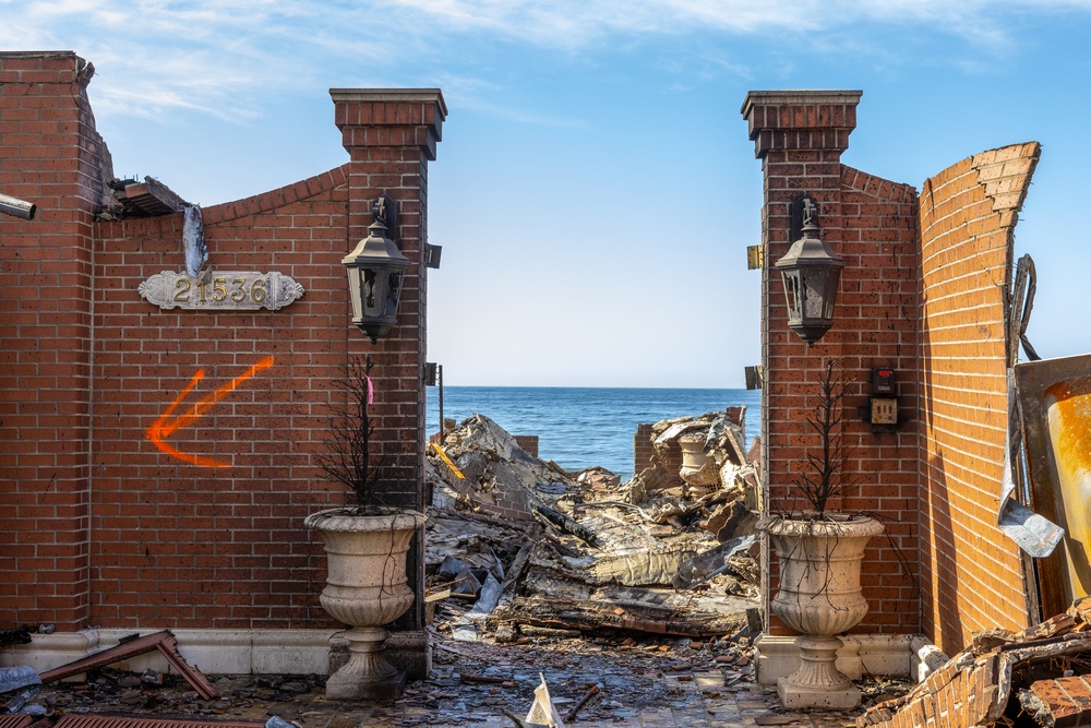 Fire-Damaged Home Awaits Debris Removal