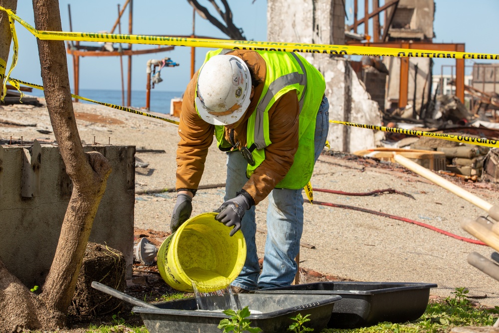 Debris Removal Continues at Fire-Damaged Home