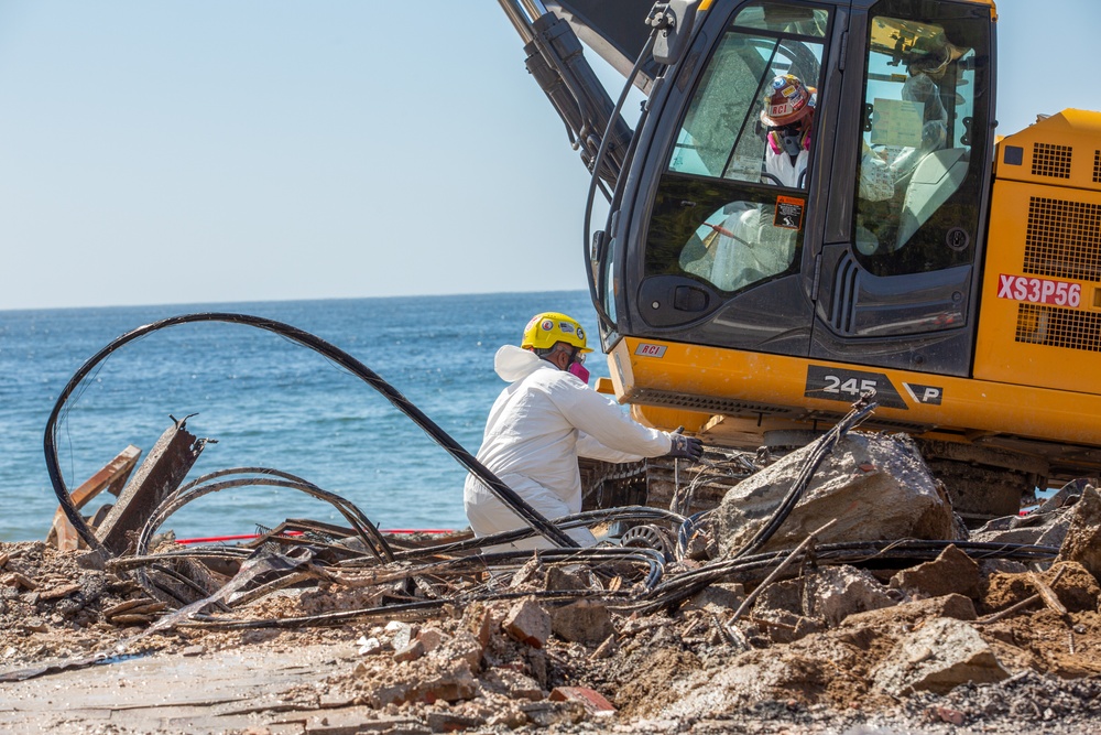 Debris Removal Continues at Fire-Damaged Home