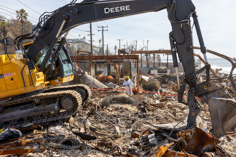 Debris Removal Continues at Fire-Damaged Home