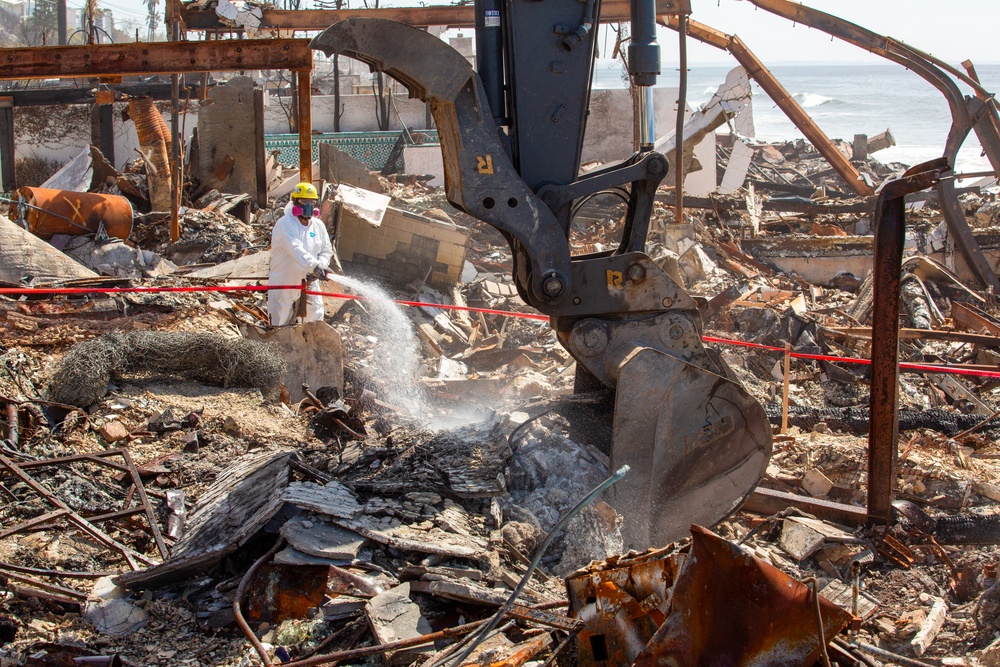 Debris Removal Continues at Fire-Damaged Home