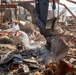 Debris Removal Continues at Fire-Damaged Home