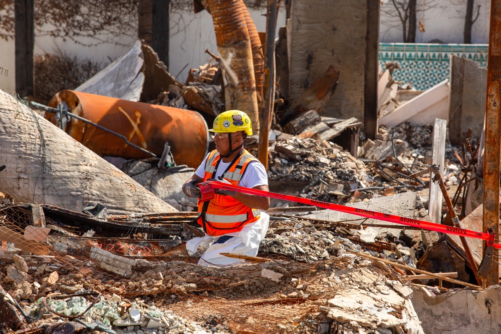 Debris Removal Continues at Fire-Damaged Home