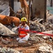 Debris Removal Continues at Fire-Damaged Home