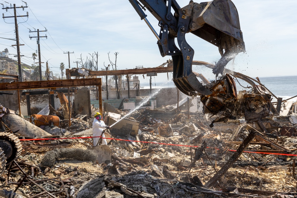 Debris Removal Continues at Fire-Damaged Home