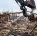 Debris Removal Continues at Fire-Damaged Home