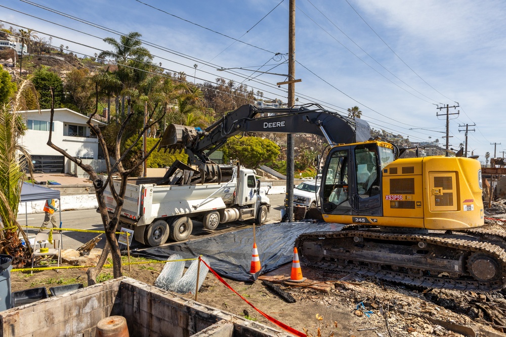 Debris Removal Continues at Fire-Damaged Home