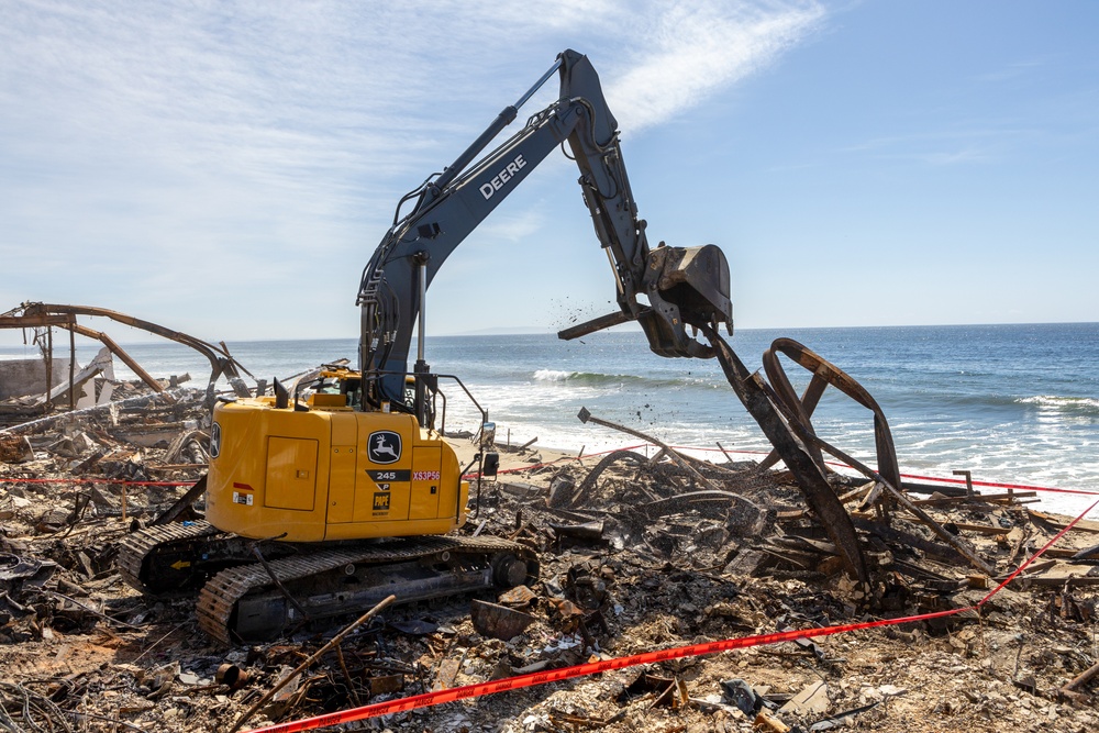 Debris Removal Continues at Fire-Damaged Home