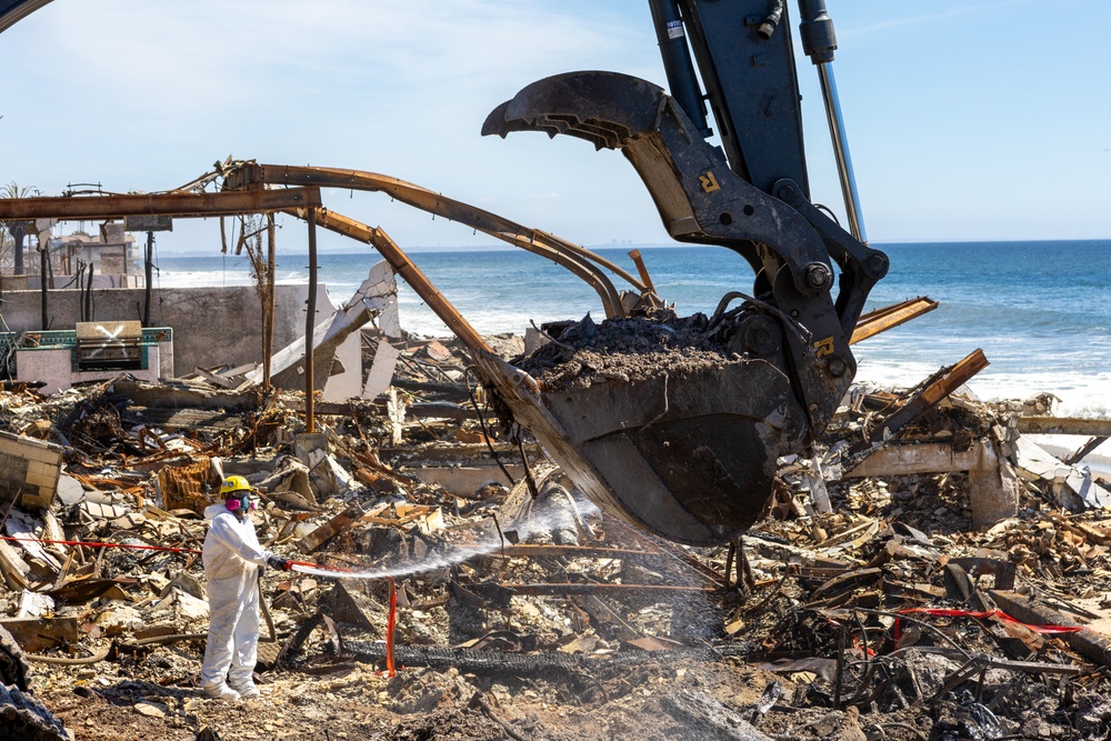 Debris Removal Continues at Fire-Damaged Home