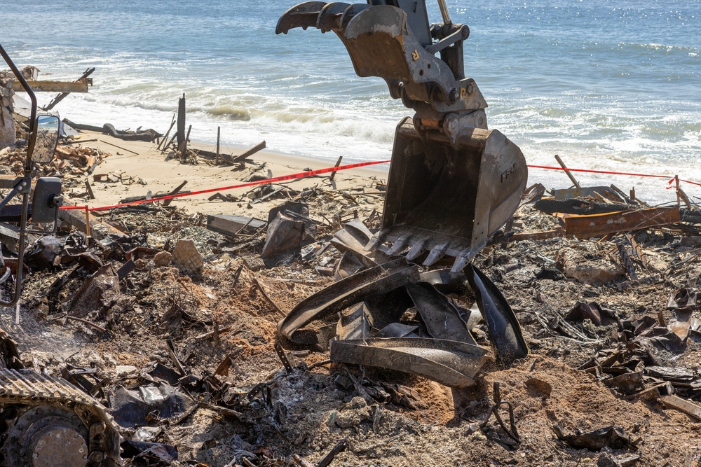 Debris Removal Continues at Fire-Damaged Home