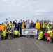 Sailors volunteer with the River City Waterway Alliance