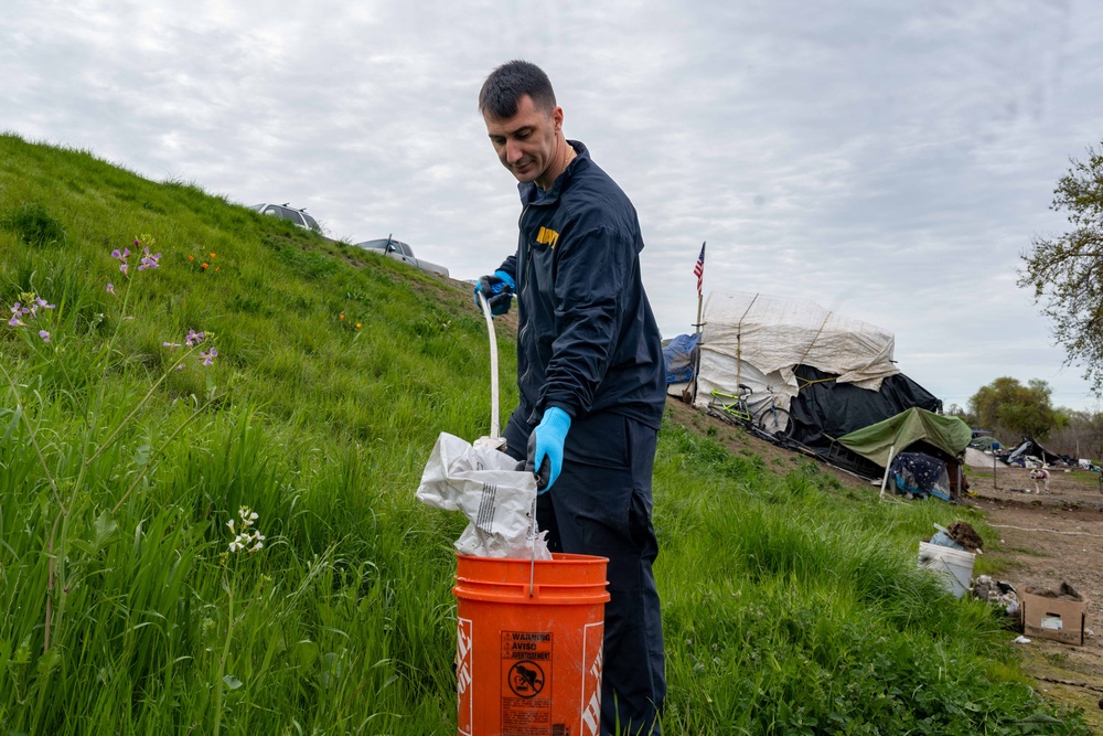 Sailors volunteer with the River City Waterway Alliance