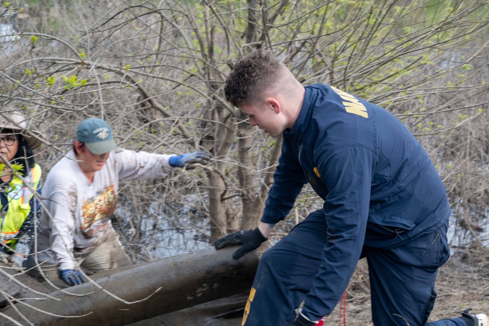 Sailors volunteer with the River City Waterway Alliance