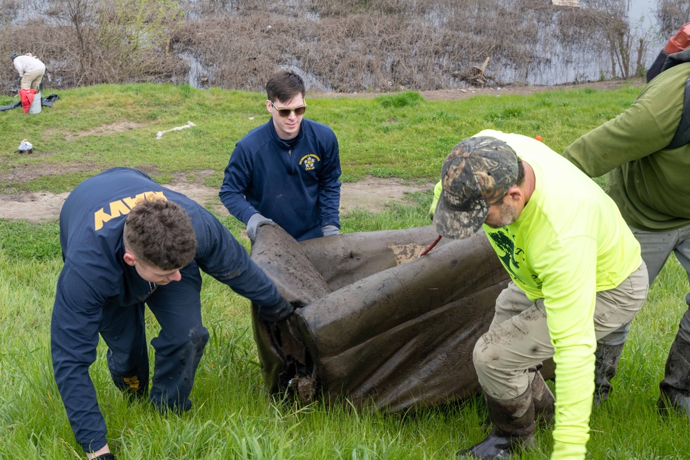 Sailors volunteer with the River City Waterway Alliance