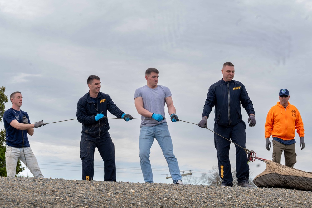 Sailors volunteer with the River City Waterway Alliance