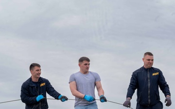 Sailors volunteer with the River City Waterway Alliance