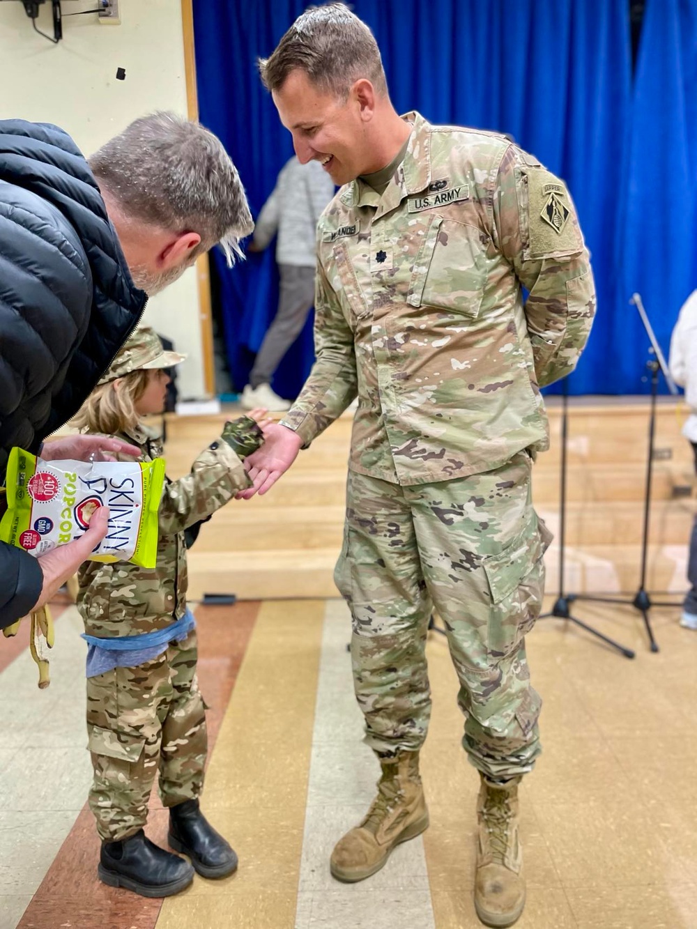 Lt. Col. Nathaniel A. Weander visits with Palisades Elementary School parents during a townhall meeting