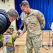 Lt. Col. Nathaniel A. Weander visits with Palisades Elementary School parents during a townhall meeting