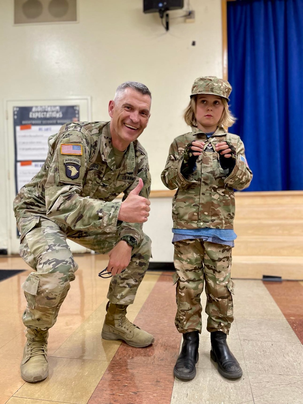 Col. Brian D. Sawser visits with Palisades Elementary School families during a townhall meeting