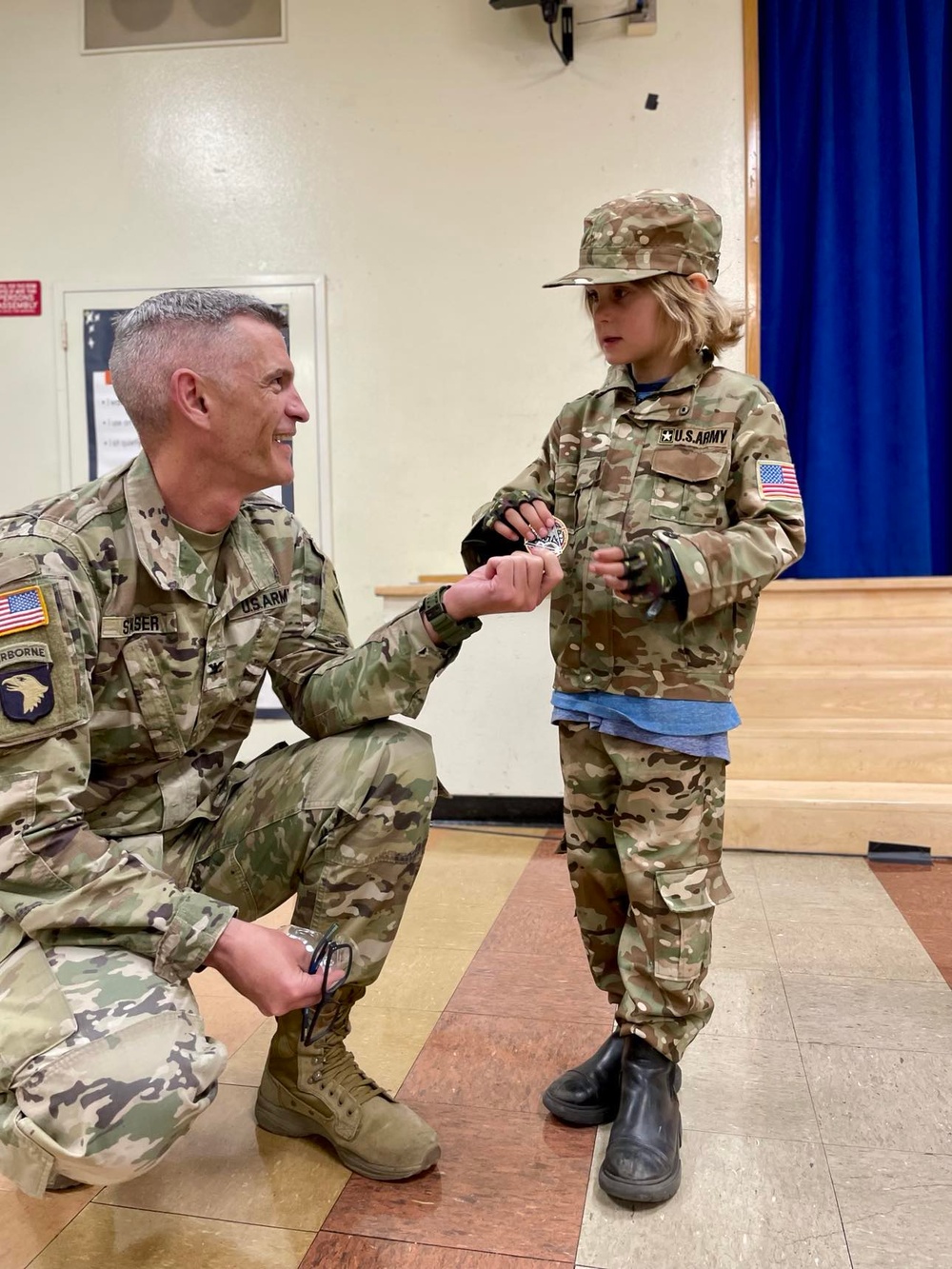 Col. Brian D. Sawser visits with Palisades Elementary School families during a townhall meeting