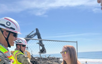 Col. Brian D. Sawser and Supervisor Lindsey P. Horvath discuss debris removal efforts in Malibu