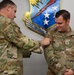 67th CW deputy commander awards Gunslinger with Gunslinger University Master patch