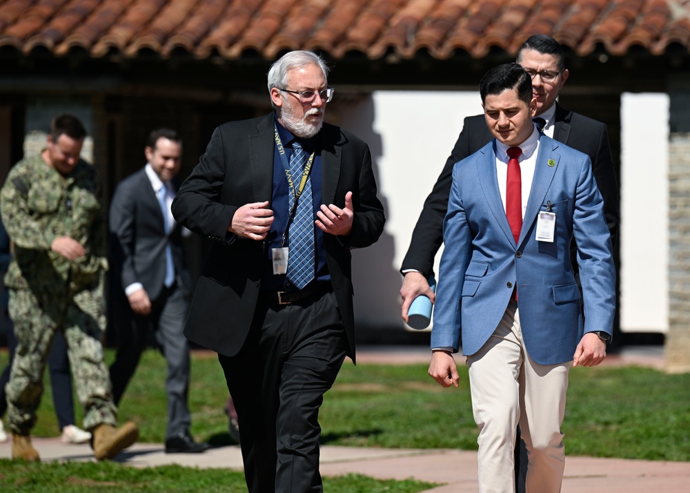 Navy Gage and Standards Laboratory Branch Head Michael Wheeler escorts Assemblyman Bill Essayli of California’s 63rd Assembly District to the Measurement Science and Technology Laboratory during an official visit to Naval Surface Warfare Center, Corona.