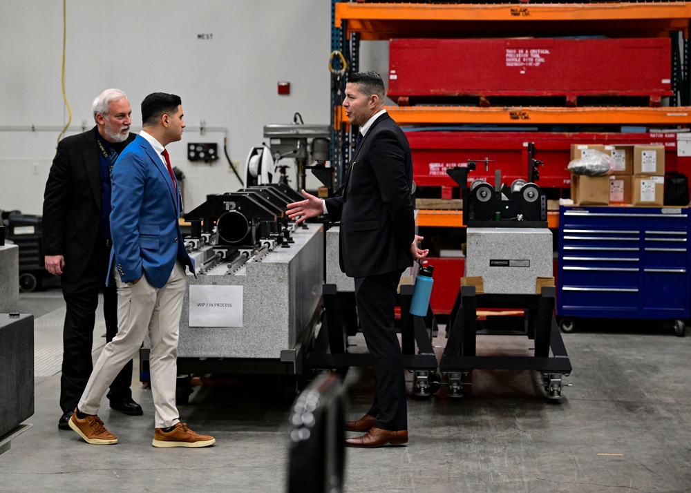 Technical Director Elvis Acosta and Navy Gage and Standards Laboratory Branch Head Michael Wheeler speak to Assemblyman Bill Essayli of California’s 63rd Assembly District during a tour of the Measurement Science and Technology Laboratory at NSWC Corona.