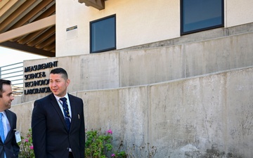Technical Director Elvis Acosta speaks to Casey Deaver, district director for the office of Assemblyman Bill Essayli, during an official visit to Naval Surface Warfare Center, Corona Division.