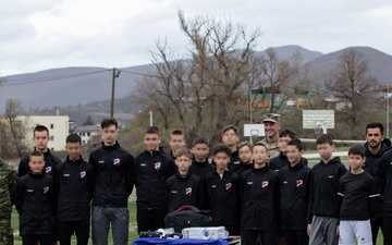 KFOR donates equipment to a local soccer team