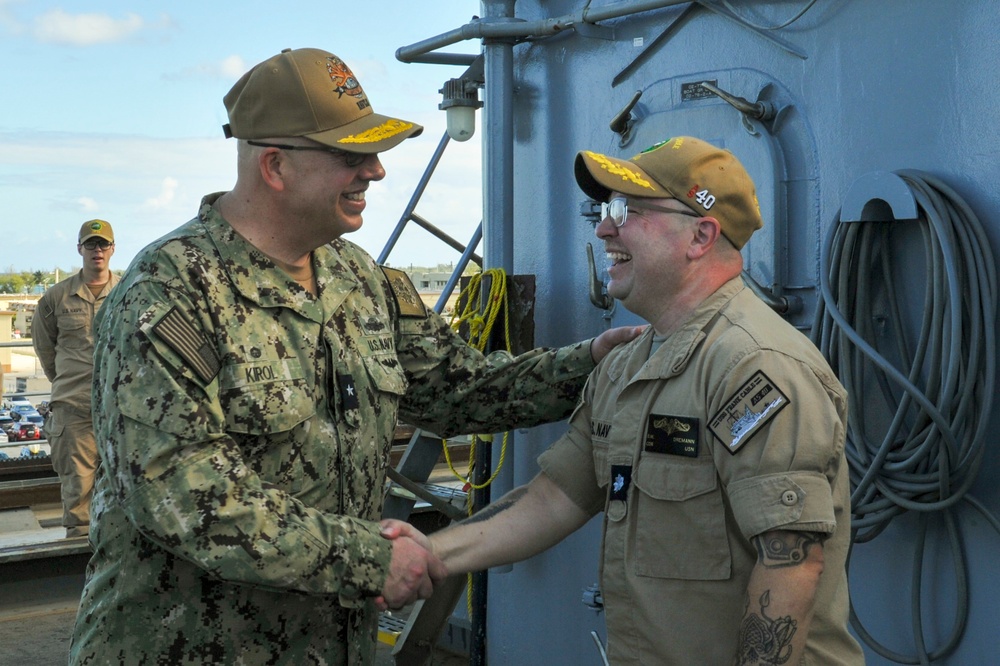 Rear Adm. Charles Kirol, commander, Navy Expeditionary Logistics Support Group, visits USS Frank Cable (AS 40)