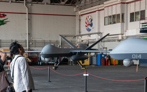 Attendees visit MQ-9 Reapers at Kadena Air Base’s America Fest