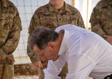 Senator John Barrasso Signs Wyoming State Flag During Visit to Wyoming Army National Guard's 115th Field Artillery Brigade in Jordan