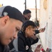 Team Souda paints a local elementary school during a community outreach event