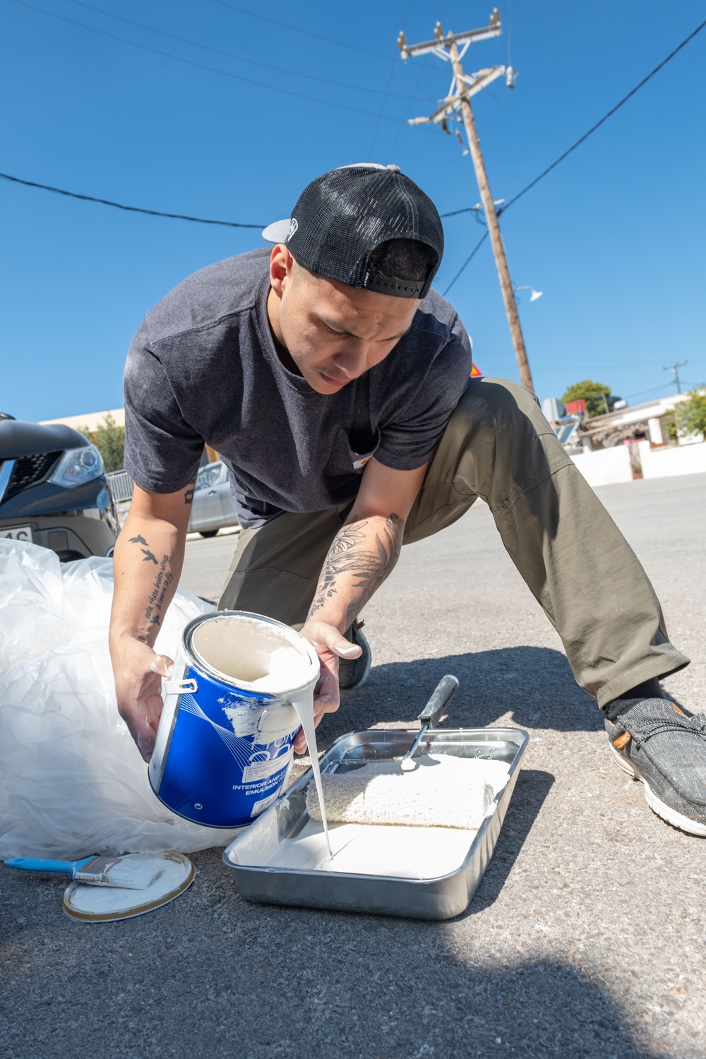Team Souda paints a local elementary school during a community outreach event