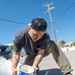 Team Souda paints a local elementary school during a community outreach event