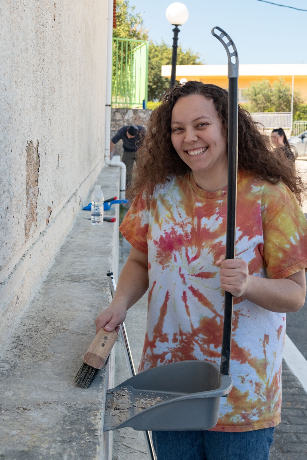 Team Souda paints a local elementary school during a community outreach event