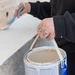 Team Souda paints a local elementary school during a community outreach event
