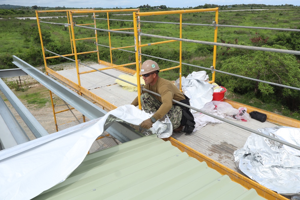 Installing Insulation &amp; Roof Paneling