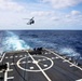 USS Gravely conducts a helicopter in-flight refueling evolution