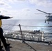 USS Gravely conducts a helicopter in-flight refueling evolution