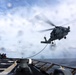 USS Gravely conducts a helicopter in-flight refueling evolution