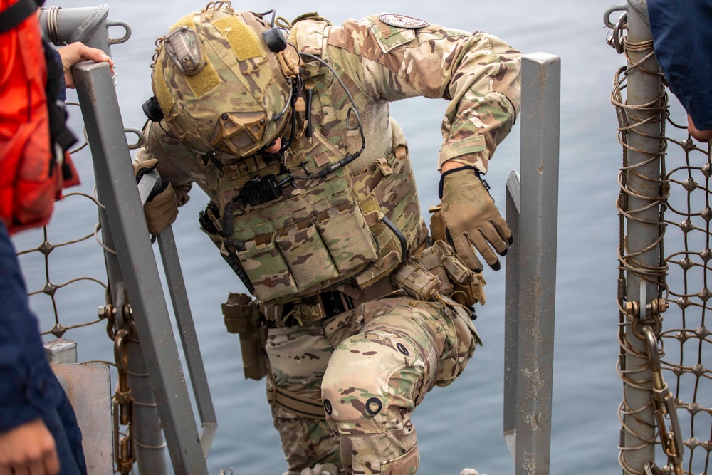 U.S. Coast Guard conducts small boat operations with USS Spruance