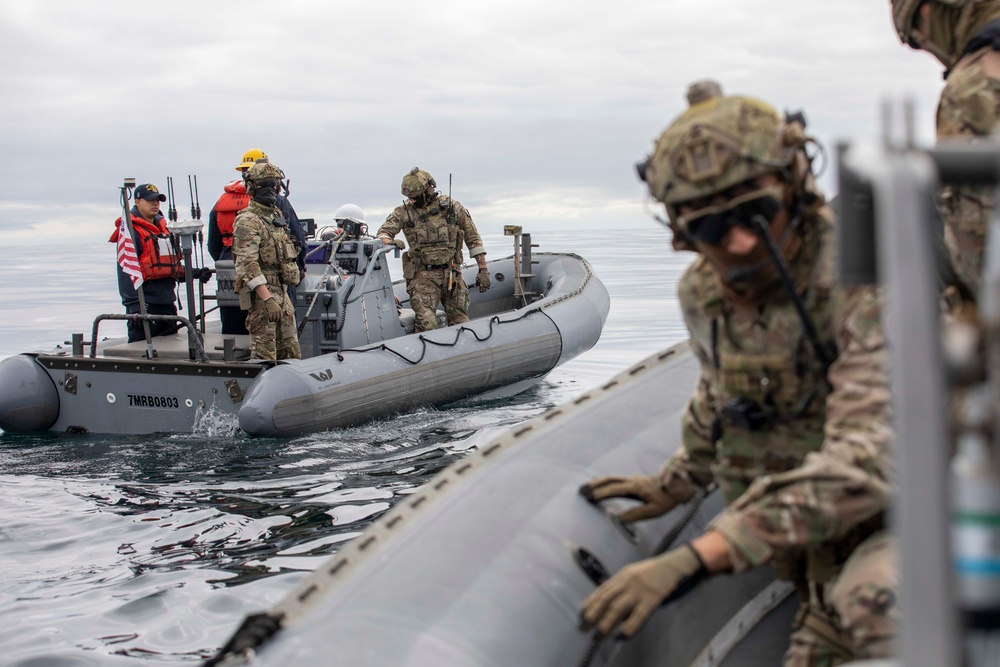 U.S. Coast Guard conducts small boat operations with USS Spruance