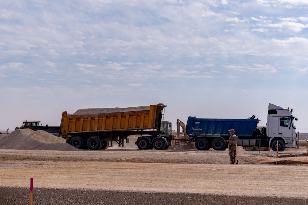 Airmen build and expand a hot cargo pad and marshalling yard in the U.S. CENTCOM AOR