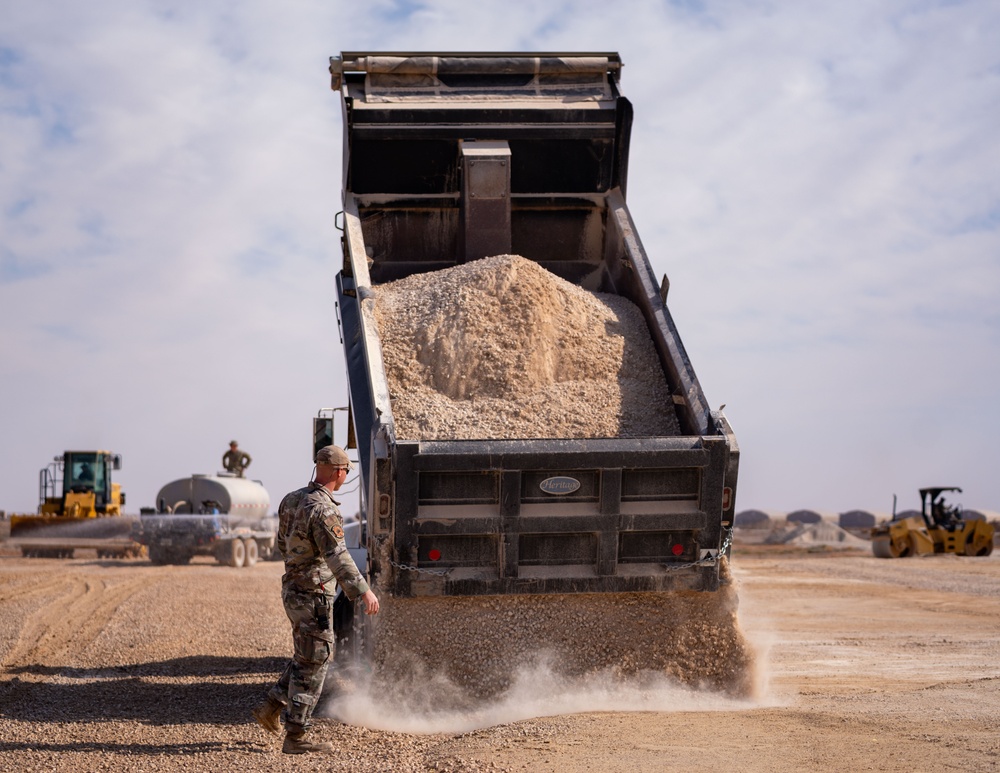Airmen build and expand a hot cargo pad and marshalling yard in the U.S. CENTCOM AOR