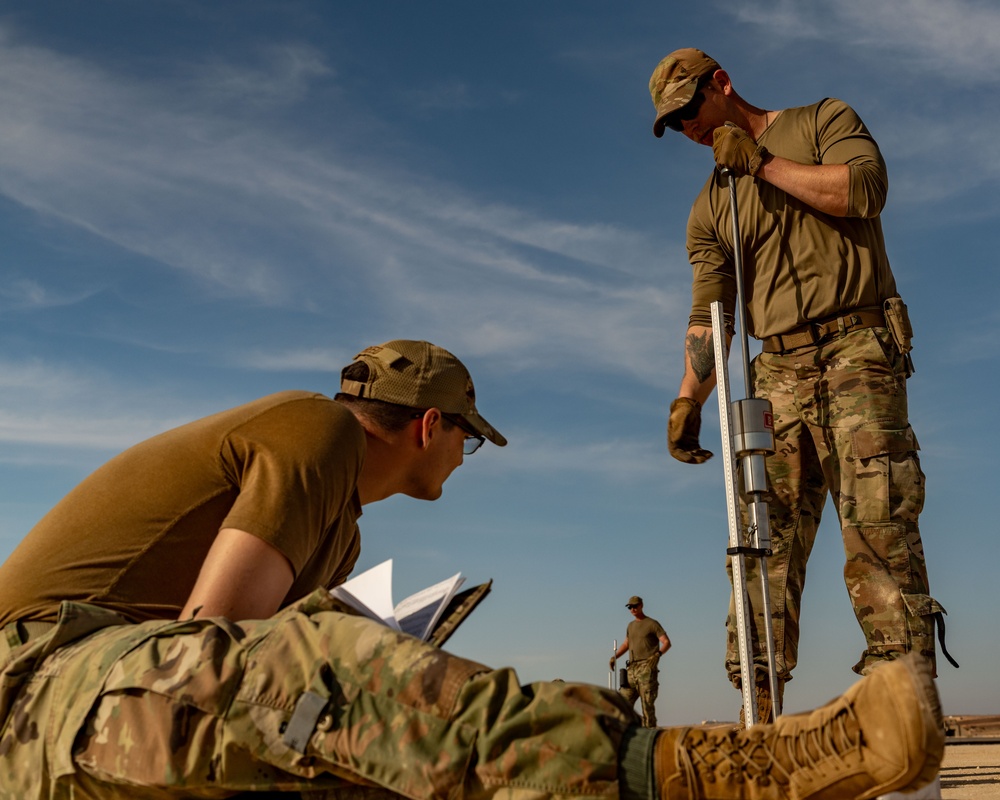 Airmen build and expand a hot cargo pad and marshalling yard in the U.S. CENTCOM AOR