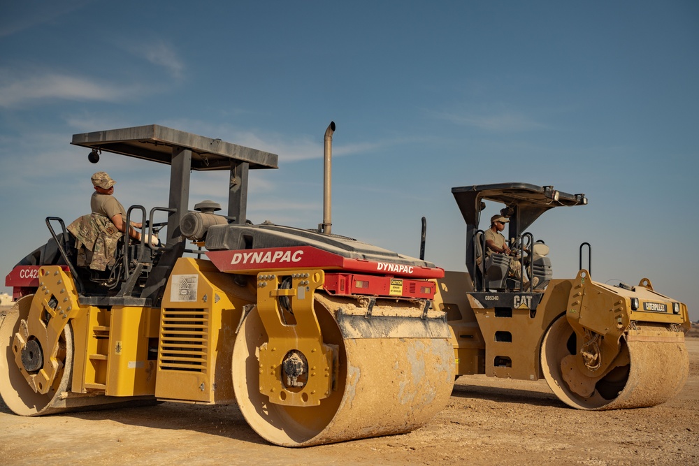 Airmen build and expand a hot cargo pad and marshalling yard in the U.S. CENTCOM AOR