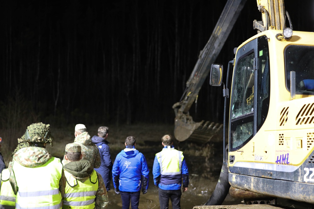 Recovery Efforts Continue Through the Night at Site of Submerged Vehicle in Search for Missing Soldiers